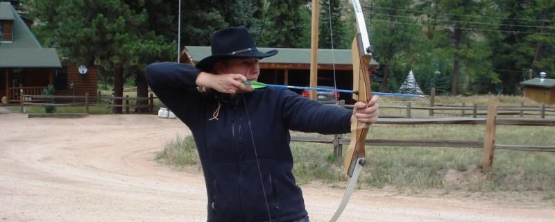 Woman hones her archery skills with a recurve bow