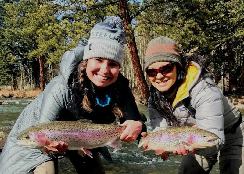 Two women holding up the trout they caught at the North Fork Ranch