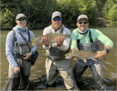 Anglers score big, catching large rainbow trout, while on the private waters at Shawnee Meadows fly fishing with North Fork Ranch Guide Service.